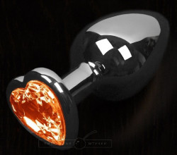 Графитовая анальная пробка с оранжевым кристаллом в виде сердечка - 6 см.