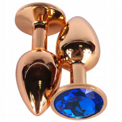 Золотистая анальная пробка с синим кристаллом - 6,8 см.