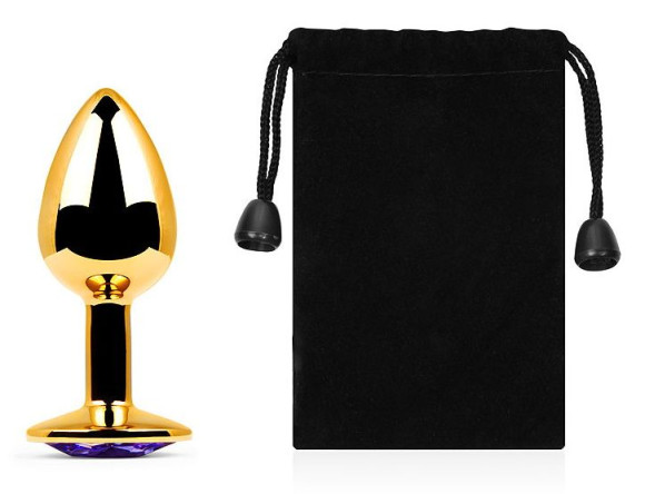 Золотистая анальная пробка с фиолетовым стразом - 7,2 см. Золотистая анальная пробка с фиолетовым стразом - 7,2 см.